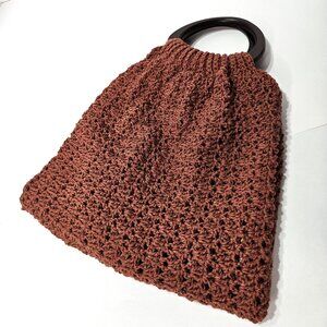 Crochet Handbag in Rust with Dark Brown Wood Handles.
